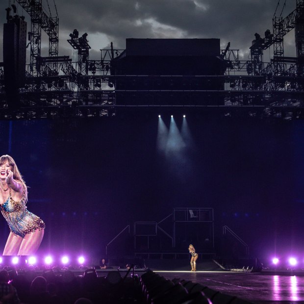 Triple treat: Taylor Swift, centre, is dwarfed by her twin images during her series of gigs at Accor Stadium in February 2024.