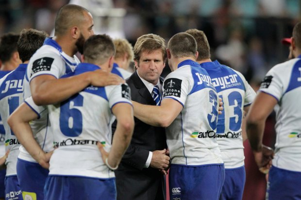 Des Hasler consoles the players after the heartache of the 2012 grand final loss to Melbourne.