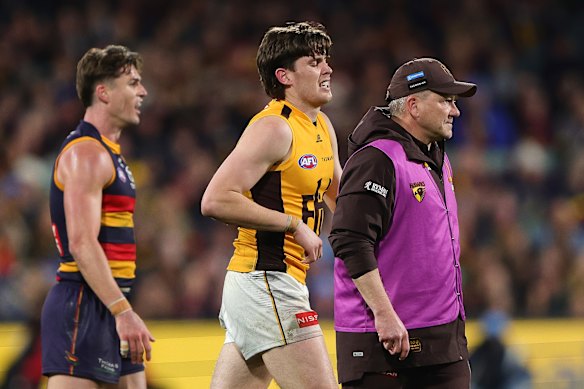Will Day hobbles off Adelaide Oval with cramp.