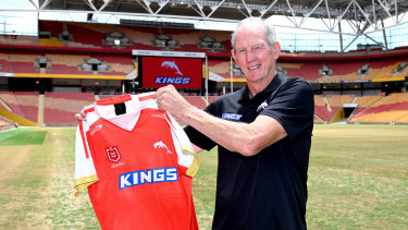 Wayne Bennett with the new jersey to be worn by The Dolphins.