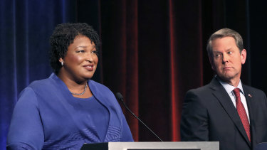 Democratic gubernatorial candidate for Georgia Stacey Abrams, left, speaks as her Republican opponent Secretary of State Brian Kemp looks on during a debate in Atlanta in October.