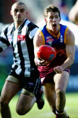 Craig McRae in action for the Lions against Collingwood in the 2003 grand final.