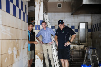 NSW Premier Dominic Perrottet (centre) with Lismore mayor Steve Krieg (right) visits Southside Hot Bread bakery in South Lismore after severe flooding devastated the northern NSW town.