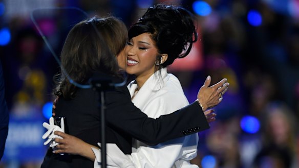 Kamala Harris (left) hugs rapper Cardi B before speaking at a campaign rally in Milwaukee.