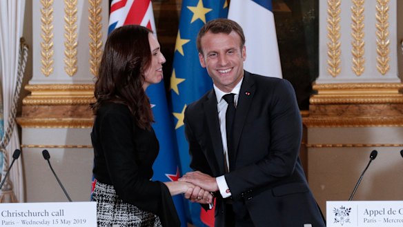 New Zealand Prime Minister Jacinda Ardern, left, and French President Emmanuel Macron, shake hands after the Christchurch Call press conference at the Elysee Palace, in Paris.