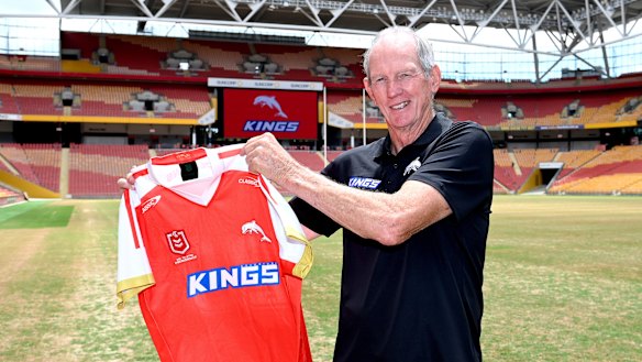 Wayne Bennett with the new jersey to be worn by The Dolphins.