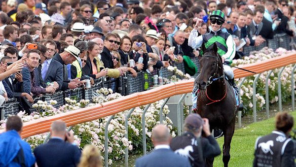Chad Schofield returns to scale after winning the Cox Plate as an apprentice aboard Shamus Award in 2013.