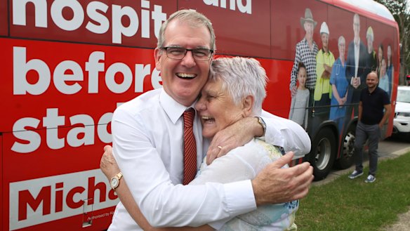 Opposition Leader Michael Daley gets a hug from swinging voter Louise Hollier of  St Clair.