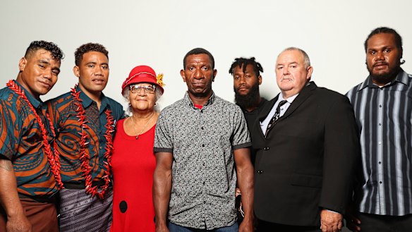 Seasonal workers Aleki and Talipope, missionary Jane Smith, worker Lazare Mankon, worker Moses, missionary Geoffrey Smith and worker Sergio, after they spoke at a Senate hearing about Pacific Island workers at Parliament House.