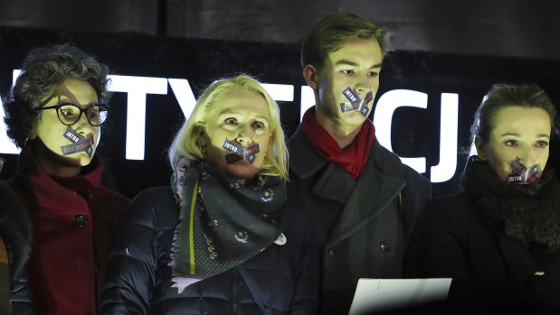 Demonstrators hold a rally to protest against changes to Poland's judiciary planned by the ruling Law and Justice party, in Warsaw on Wednesday.