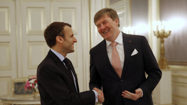 Dutch King Willem-Alexander shakes hands with French President Emmanuel Macron last month.