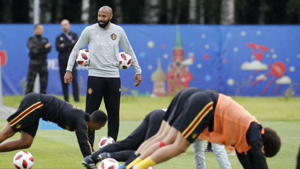 Thierry Henry looks on as Belgium players train.