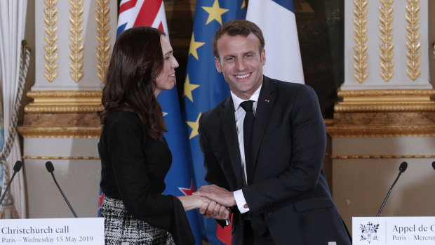 New Zealand Prime Minister Jacinda Ardern, left, and French President Emmanuel Macron, shake hands after the Christchurch Call press conference at the Elysee Palace, in Paris.