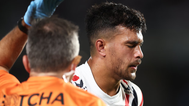 Joseph Suaali’i leaves the field on Friday night after taking a knock to the head.