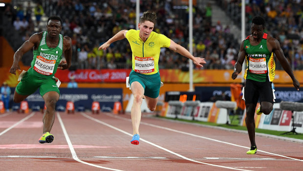 Flying finish: Rohan Browning of Australia (centre) crosses line in the second mens 100m semi-final.