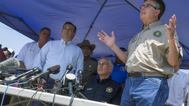 Senator Ted Cruz, second from left, Texas Governor Greg Abbott, second from right, and Lieutenant Governor Dan Patrick, right, speak at a press conference in the wake of the Santa Fe shooting