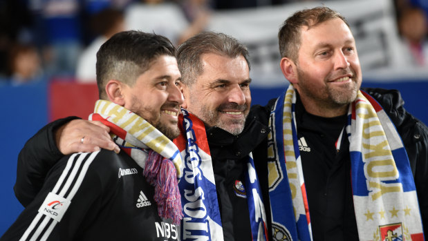 Arthur Papas celebrates Yokohama F. Marinos' title win last season with Ange Postecoglou and Peter Cklamovski, who now coaches Japanese rivals Shimizu S-Pulse.