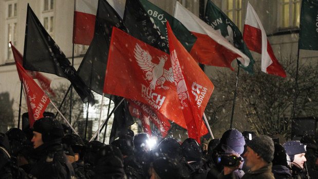 Far-right groups hold a demonstration in front of the presidential palace in Warsaw in February to support a law that would prevent speech linking the Polish nation to the Holocaust.