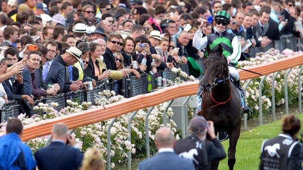 Chad Schofield returns to scale after winning the Cox Plate as an apprentice aboard Shamus Award in 2013.
