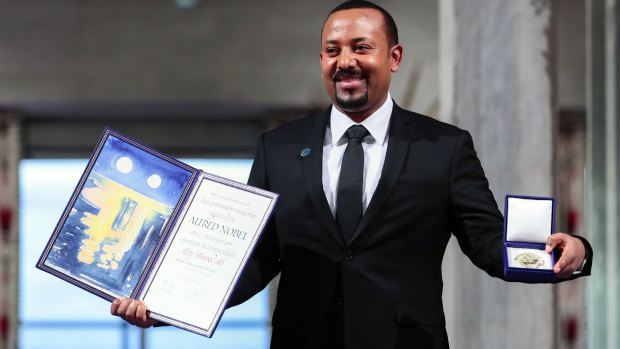 Ethiopia's Prime Minister Abiy Ahmed poses for the media after receiving the Nobel Peace Prize during the award ceremony in Oslo City Hall, Norway, last year.