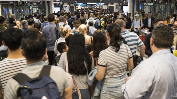 Commuters endure major overcrowding at Sydney's Town Hall station.