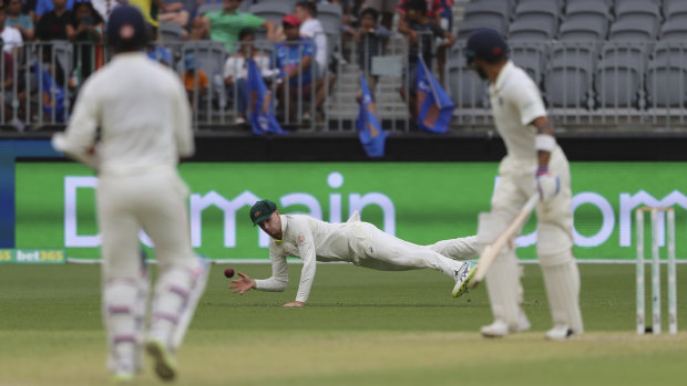 Caught out: Peter Handscomb takes the catch that dismissed Indian master blaster Virat Kohli.