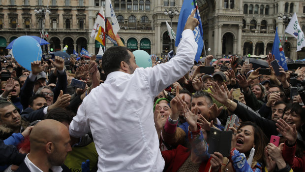 Supporters reach out to touch League leader Matteo Salvini during a rally organised by the nationalist party. 