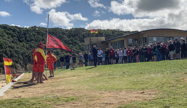Port Campbell SLSC pauses for a minute's silence  after the drowning deaths of rescue volunteers Ross and Andrew Powell.