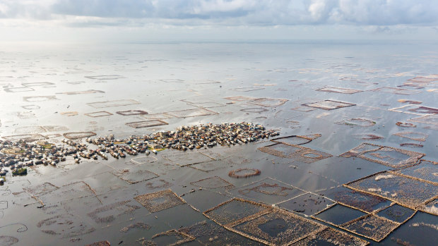 Ganvie, a town in West Africa's Benin seemingly built on a lake surrounded by a grid of artificial fisheries.