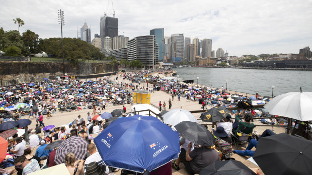 Thousands wait at Circular Quay in preparation for New Year's Eve in Sydney on Monday.