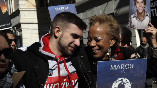 Sex abuse survivor Alessandro Battaglia is hugged by survivor and founding member of the ECA (Ending Clergy Abuse), Denise Buchanan, right, during a march in Rome on Saturday.