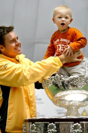 Todd Woodbridge with son Beau at a Davis Cup triumph in 2003. 