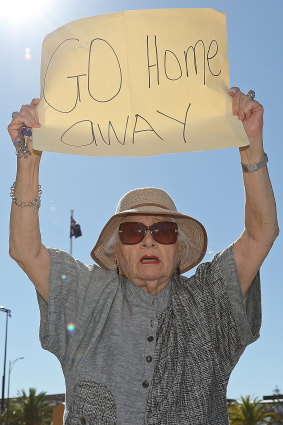 An resident protests as the MSC Magnifica is berthed at the Fremantle Passenger Terminal on Tuesday.