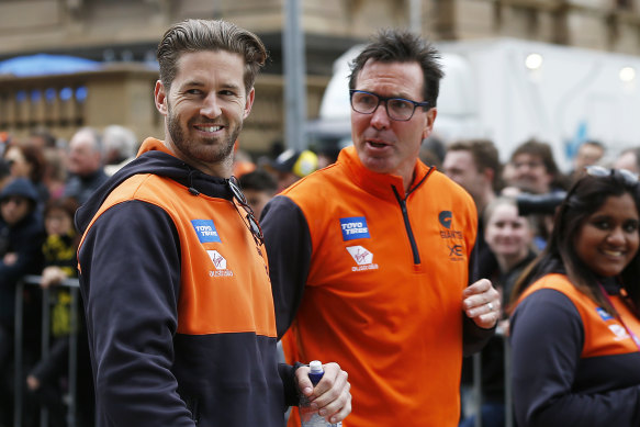 Wayne Campbell with injured Giant Callan Ward at the grand final parade on Friday.