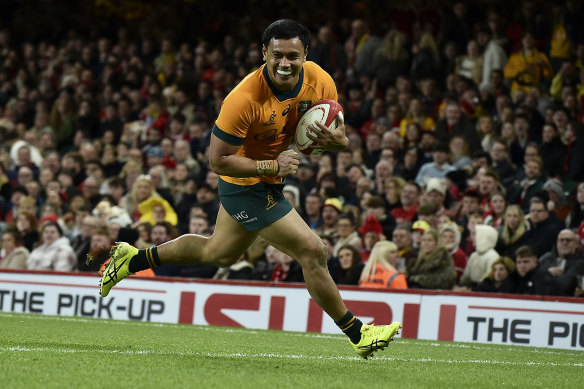 Len Ikitau scores during the big victory over Wales.