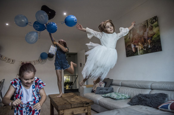 Kelly Hunt's daughters playing inside their flat. 