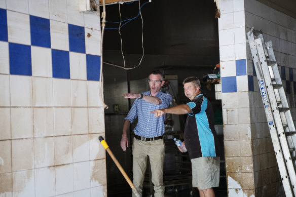 Mr Perrottet visiting a flooded bakery in South Lismore on Saturday.