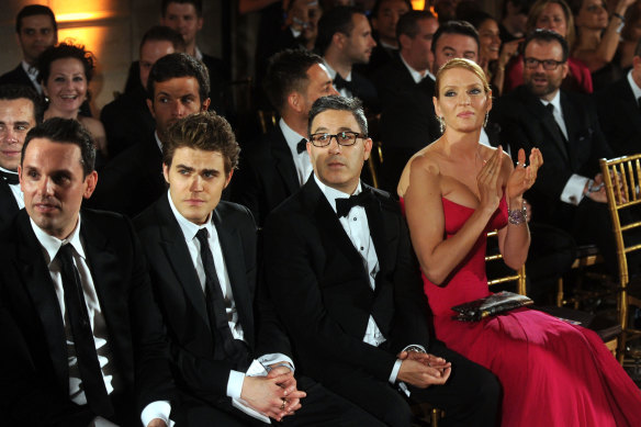 Diverse much?  The 2013 Golden Globes with Paul Wesley, Jason Weinberg and Uma Thurman. 