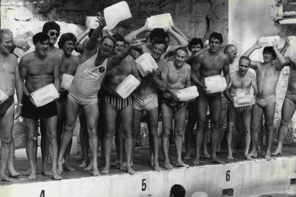 Bondi Icebergs officially open their 51st swim season in 1980. Marathon swimmer Des Renford (in old style costume) throws the first ice block. 