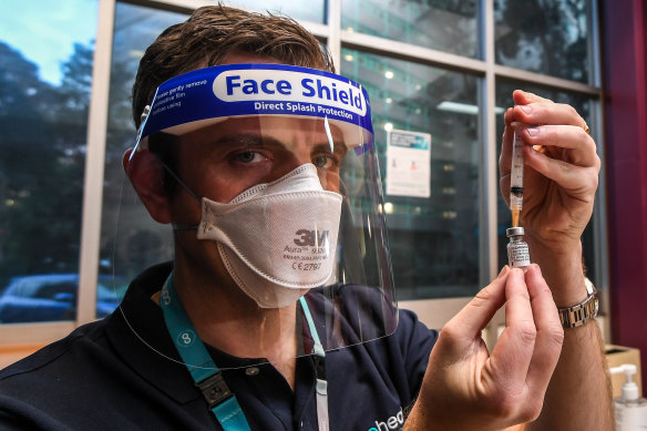 A Cohealth nurse at a pop-up vaccination clinic at the North Melbourne  public housing tower that was locked down last year.