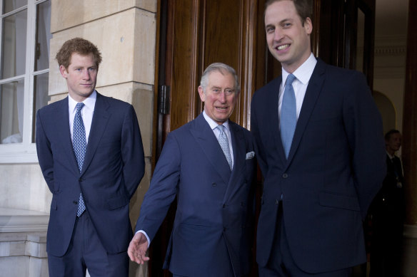 Charles with princes Harry and William in 2014.
