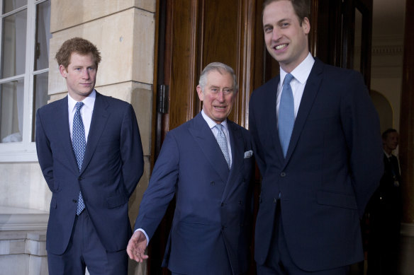 Charles with princes Harry and William in 2014.