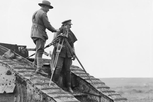 Anzac photographer George Hubert Wilkins and his camera documented the troops as they fought on the Western Front, pictured in 1918 in France with Sergeant William Joyce.