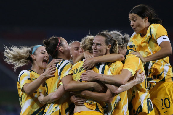The Matildas celebrate after Clare Polkinghorne scored the fourth against Vietnam.