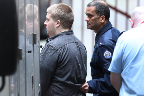 Jaymes Todd is escorted to a prison van after his appearance at the Supreme Court on Tuesday. 