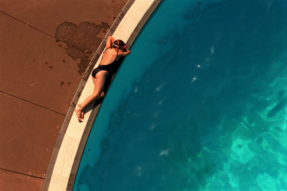A swimmer relaxes by the diving pool in 2003. 