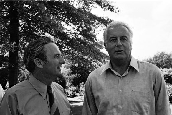 Bill Hayden (left) with then-prime minister Gough Whitlam in the grounds of Yarralumla in Canberra in 1975.