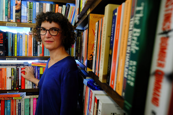 Anna MacDonald says the extra wages she pays at The Paperback Bookstore are worth it.