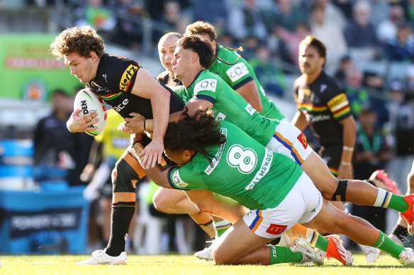 Canberra’s Josh Papalii and Kaeo Weekes combine to pull down Penrith forward Liam Martin.