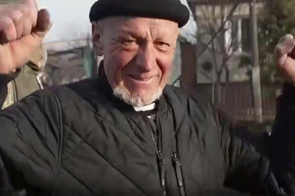 A resident of Sudzha, in Kursk, celebrates meeting Russian soldiers.